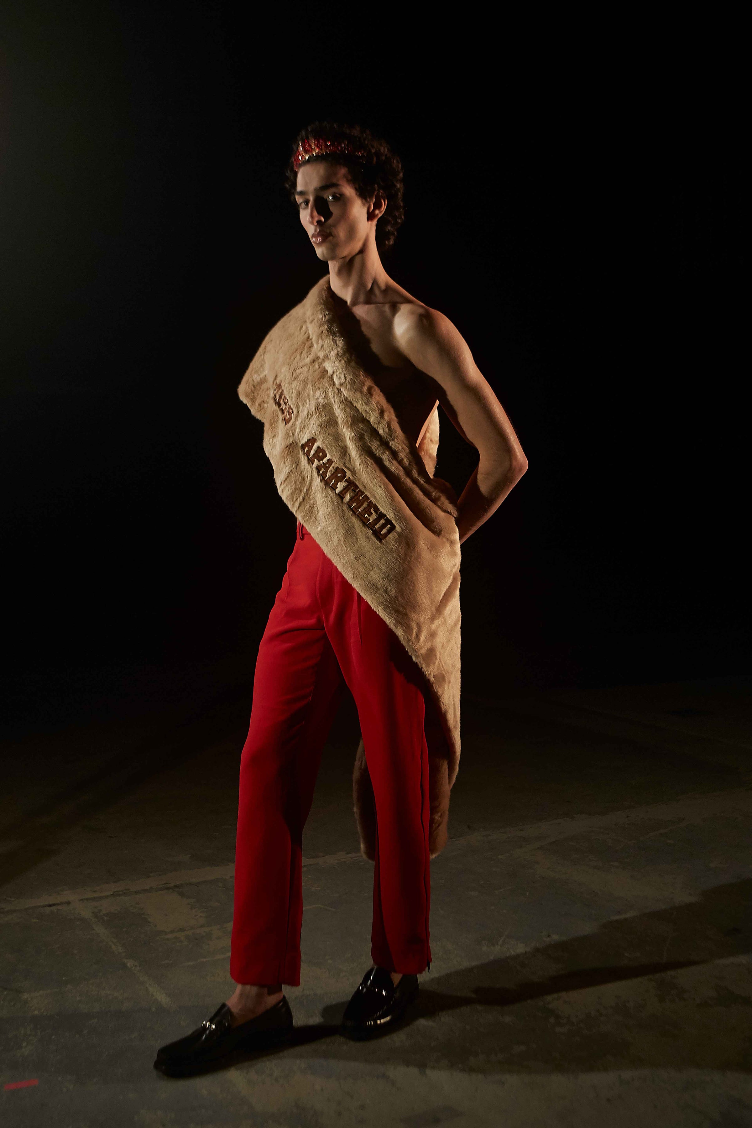 Qaher Harhash wearing Trashy Clothing AW 21/22 Errorvision Miss Apatheid Faux Fur Sash